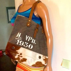 Myra Bag. Army green with cowhide. Excellent condition.